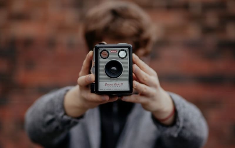 person with old brownie camera