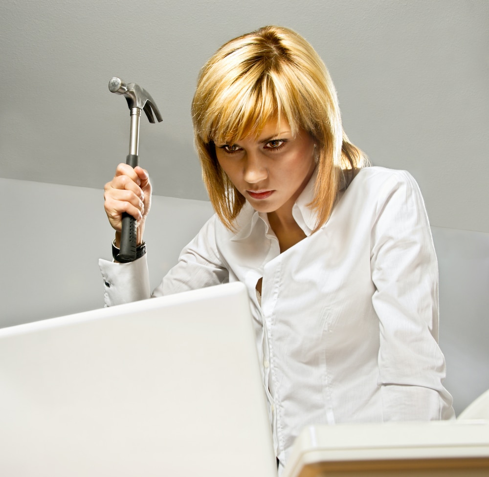 business woman with hammer