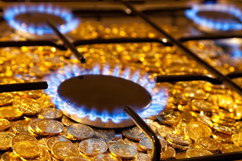 Gas burner over gold coins